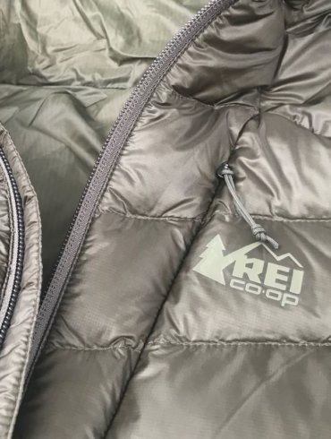 This photo shows the REI Co-op Magma 850 Down Hoodie 2.0 men's down jacket in a closeup.