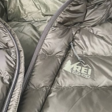 This photo shows the REI Co-op Magma 850 Down Hoodie 2.0 men's down jacket in a closeup.