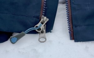 This photo shows a closeup of the main center zipper on the Stio Environ Jacket.