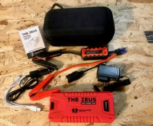This photo shows the entire The Zeus portable battery jump starter kit.