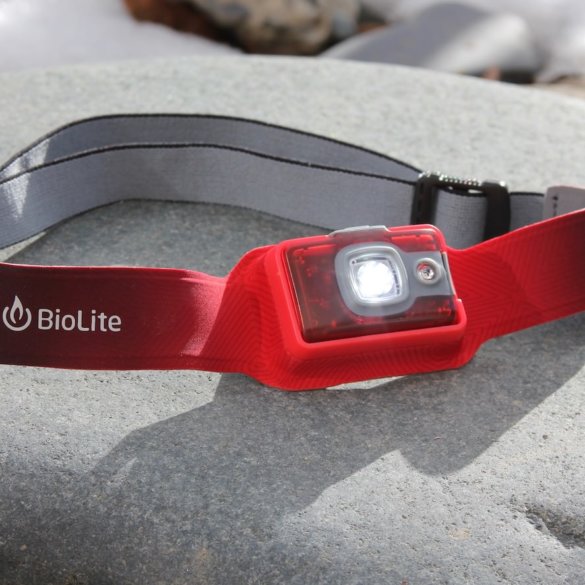 This photo shows the BioLite HeadLamp 200 headlamp with the light on.
