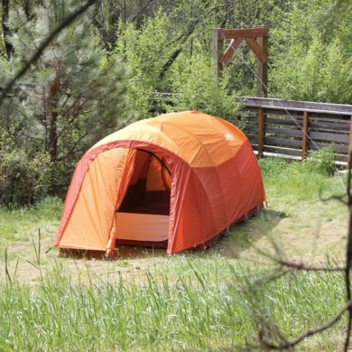 This best camping tents photo shows a camping tent set up at a campsite outside.