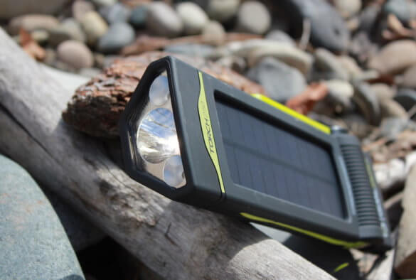 This review photo shows the Goal Zero Torch 250 solar flashlight and phone charger outside.