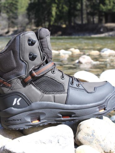 This review photo shows the Korkers Terror Ridge wading boots on rocks near a river.