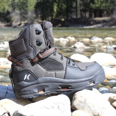 This review photo shows the Korkers Terror Ridge wading boots on rocks near a river.