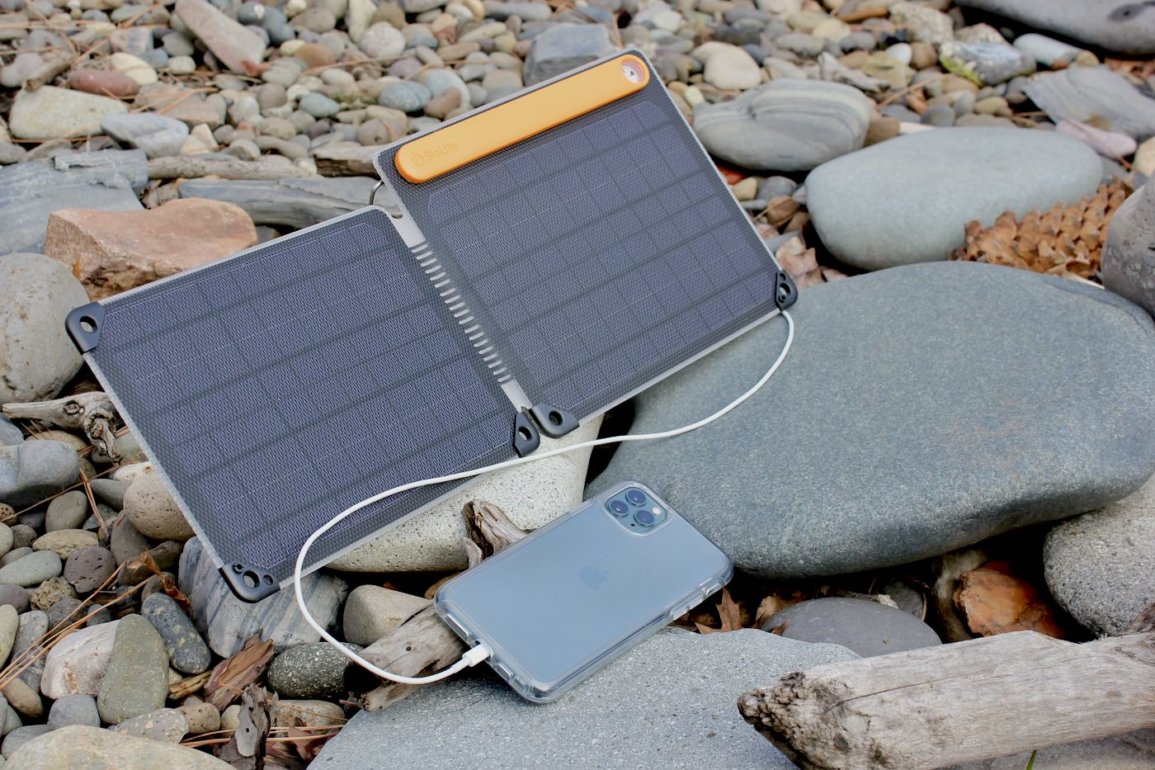 This review photo shows the BioLite SolarPanel 10+ charging a smartphone in the sun.