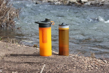 This photo shows the GRAYL GEOPRESS Purifier and GRAYL ULTRALIGHT Purifier next to a creek.
