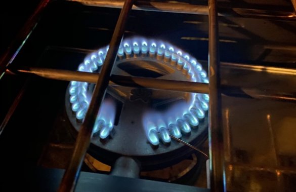 This photo shows the Pro burner while lit with blue flames.