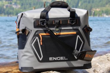 This best soft cooler photo shows a closeup of a soft-sided cooler being tested for review outside near a lake.