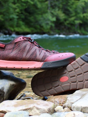 This review photo shows the Chaco Torrent Pro Water shoes next to a river.