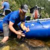 This photo shows Man Makes Fire expert fly fishing and rafting gear testers out on the river testing and fishing with the NRS Star Outlaw Raft Fishing Package.