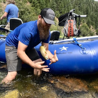 This photo shows Man Makes Fire expert fly fishing and rafting gear testers out on the river testing and fishing with the NRS Star Outlaw Raft Fishing Package.