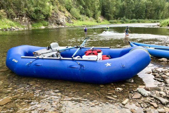 This photo shows the STAR Outlaw 140 raft being used for a float and swim trip on a river.