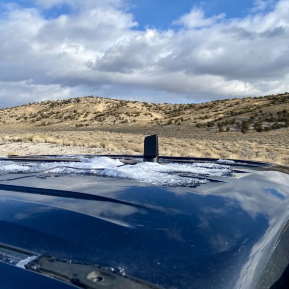This photo shows the weBoost Drive Reach antenna placed on a pickup truck in a remote area of high-elevation desert during product testing and review in Nevada.