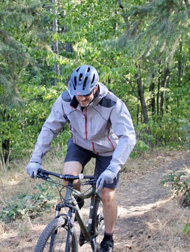 This photo shows the author wearing the Showers Pass Elements Jacket during testing during the mountain biking review process.