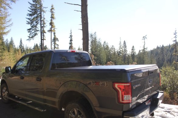 This photo shows a pickup with the Fas-Top Travel Package installed with the tonneau cover deployed.
