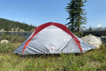 This review photo shows the L.L.Bean Mountain Light HV 3 Tent set up near a backcountry mountain lake during testing.