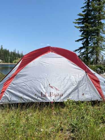 This review photo shows the L.L.Bean Mountain Light HV 3 Tent set up near a backcountry mountain lake during testing.