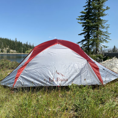 This review photo shows the L.L.Bean Mountain Light HV 3 Tent set up near a backcountry mountain lake during testing.