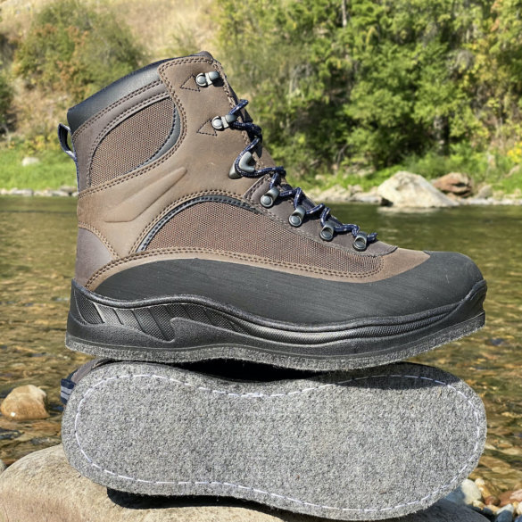 This photo shows the Cabela's Hiker Felt Sole Wading Boots next to a river.