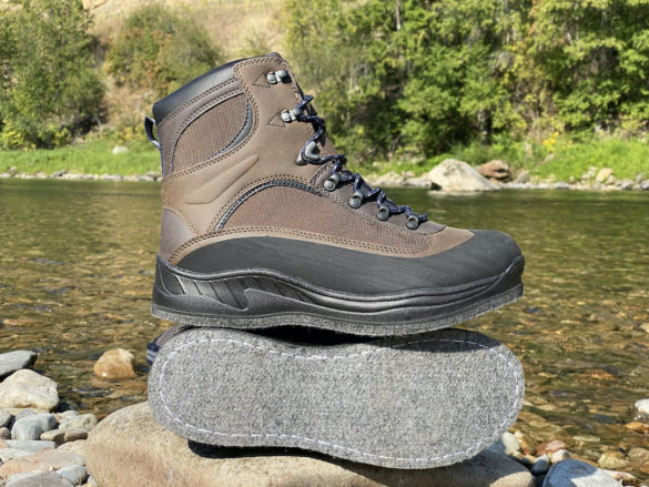 This photo shows the Cabela's Hiker Felt Sole Wading Boots near a river before testing during a fly fishing trip.