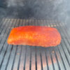 This photo shows a smoking pork loin on a Traeger Pro 575 Pellet Grill.