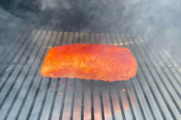 Pork loin cooking on Traeger Pro 575 Pellet Grill during the review process.