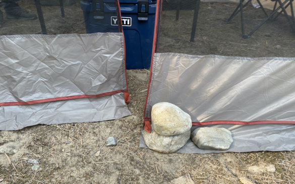 This photo shows the bottom of the zipper on the door of the Bass Pro Shops Eclipse Refuge Screen House during testing and review while camping.