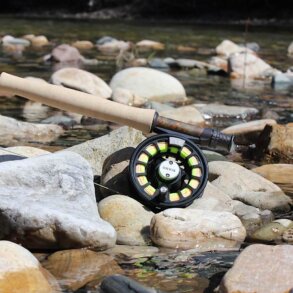 Orvis Recon Fly Rod Outfit on rocks near a trout fishing river in Idaho.