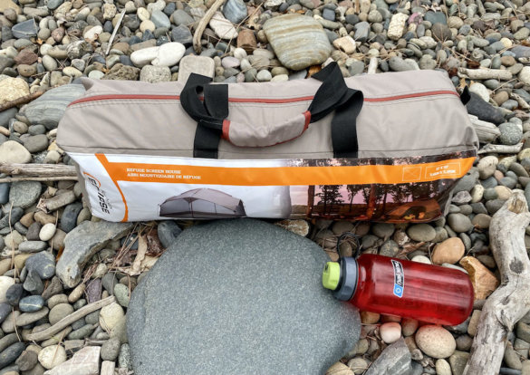 This photo shows the Bass Pro Shops Eclipse Refuge Screen House packed up in its included carry bag.