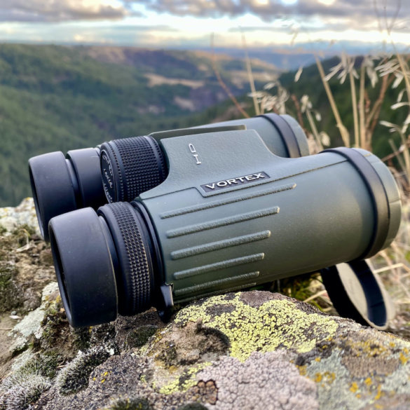 This review photo shows the author's Vortex Viper HD 10x42 binoculars outside during a hunting trip.