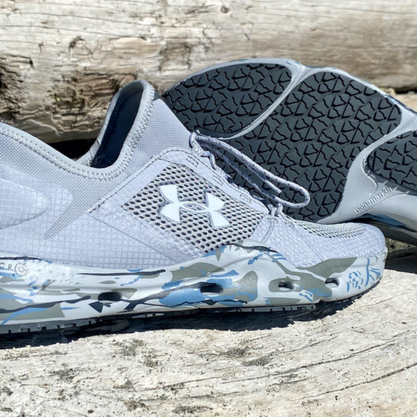 This review photo shows the men's UA Kilchis Fishing Shoes on a log at the beach.