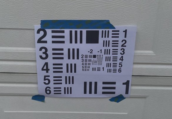 This photo shows a USAF contrast chart taped to a garage door during the Maven C.3 testing process.