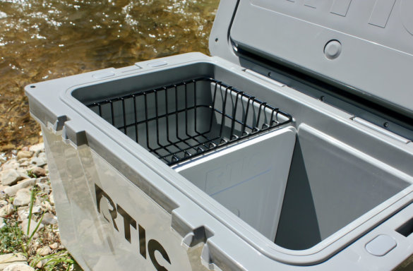 This photo shows the interior of the RTIC Ultra-Light Cooler with the included rim basket and ice-pack divider.