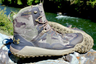 This review photo shows the Under Armour UA HOVR Dawn WP Boots on a rock during the initial testing phase by the author.