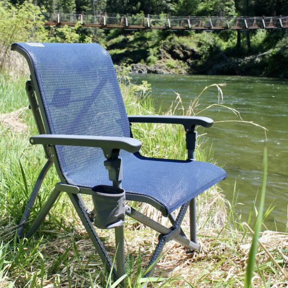 This review photo shows the YETI Trailhead Camp Chair near a river during the testing process by the author.