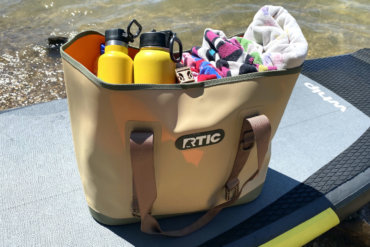 This review photo shows the RTIC Large Tote Bag at the beach.