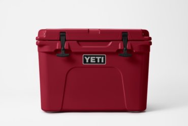 This photo shows the YETI Tundra 65 cooler in the Harvest Red color option.