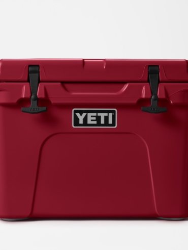 This photo shows the YETI Tundra 65 cooler in the Harvest Red color option.