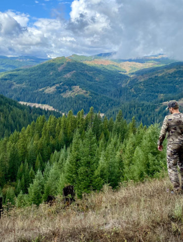 This hunting gifts photo shows a hunter in a forest while hunting for elk and deer.