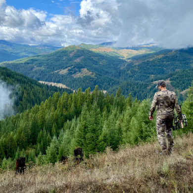 This hunting gifts photo shows a hunter in a forest while hunting for elk and deer.