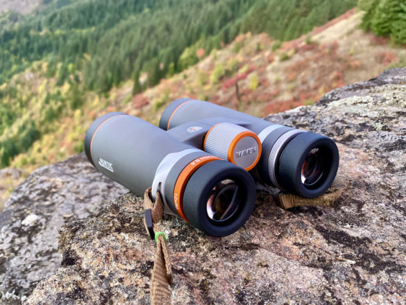 This photo shows the 12x50 Maven B.6 Binoculars outside on a mountain top rock.