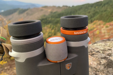 This review photo shows the Maven B.6 Binocular in the 12x50 configuration outside on a mountain top during the testing process.