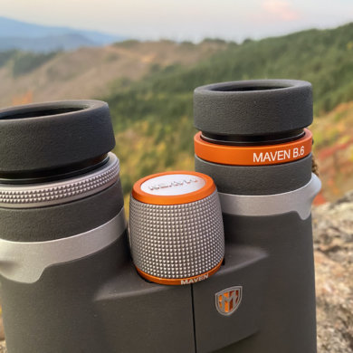 This review photo shows the Maven B.6 Binocular in the 12x50 configuration outside on a mountain top during the testing process.