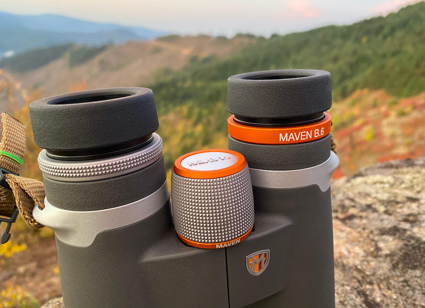 This review photo shows the Maven B.6 Binocular in the 12x50 configuration outside on a mountain top during the testing process.