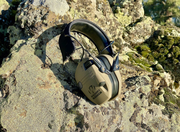 This review photo shows the Walker's Slim Digital Razor Muffs on a rock.