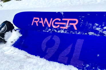 This photo shows a closeup of the Fischer Ranger 94 FR skis in the snow.