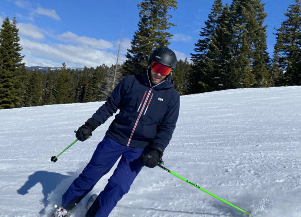 This photo shows the author wearing the Helly Hansen Alpha Lifaloft Jacket while skiing during the testing and review process.