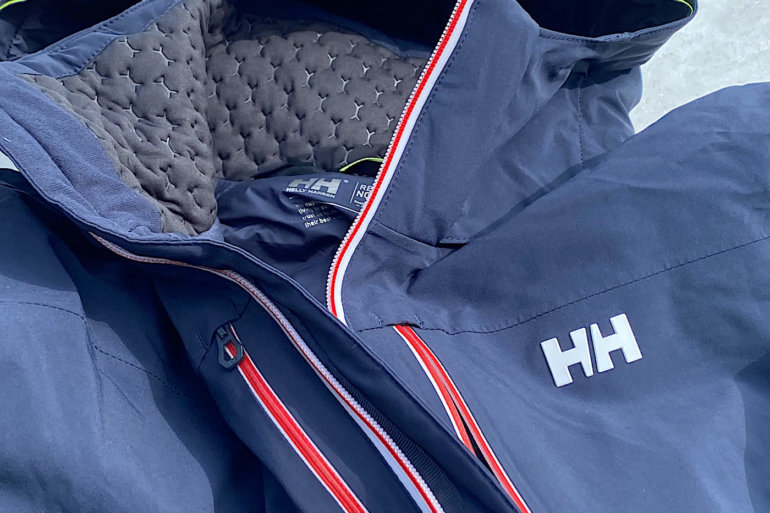 This review photo shows the Helly Hansen Alpha Lifaloft Jacket for skiing.
