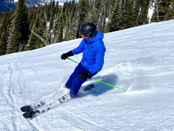 This photo shows the author wearing the men's Helly Hansen Odin 9 Worlds 2.0 Outdoor Shell Jacket while skiing during the testing and review process.